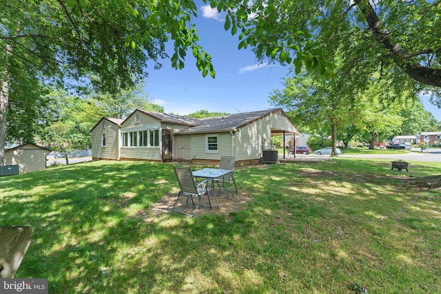 1321 Bayshire Ln, Herndon, VA 20170 - rear view of property with a lawn and central AC