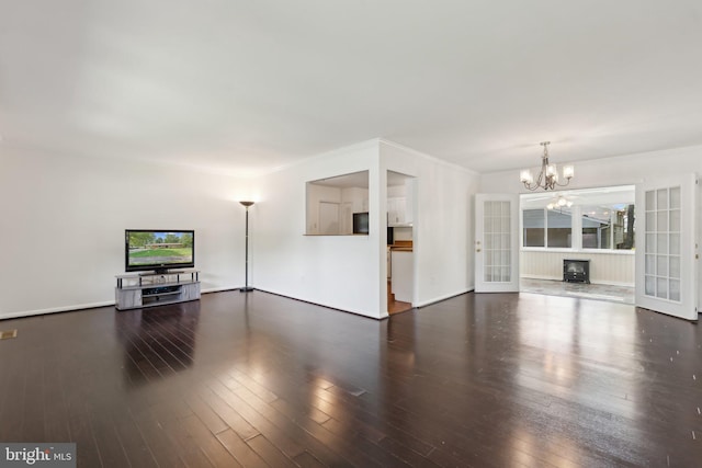 1321 Bayshire Ln, Herndon, VA 20170 - unfurnished living room with a chandelier, hardwood / wood-style floors, ornamental molding, and baseboards