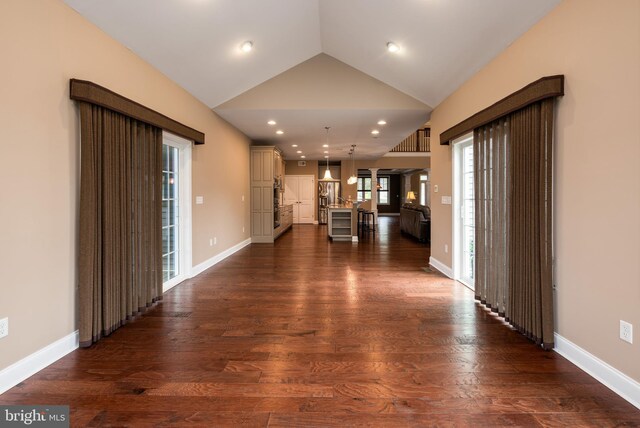 31306 Lakeview Blvd, Lewes, DE 19958 - hallway featuring dark wood-style floors, baseboards, recessed lighting, and vaulted ceiling