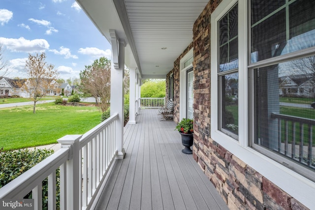 31306 Lakeview Blvd, Lewes, DE 19958 - deck with a residential view, a yard, and covered porch