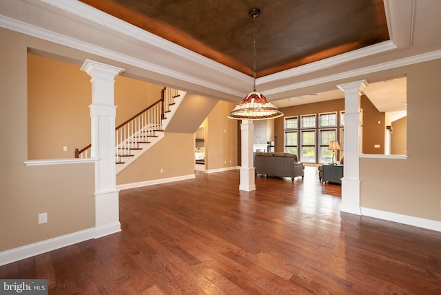 31306 Lakeview Blvd, Lewes, DE 19958 - unfurnished living room with stairway, wood finished floors, a raised ceiling, and ornate columns