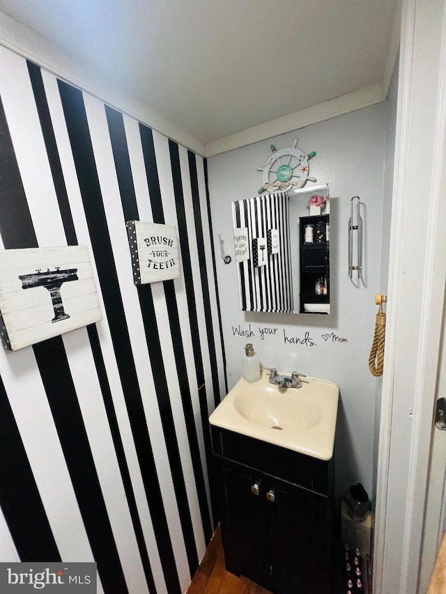 5625 Loretto Ave, Philadelphia, PA 19124 - bathroom featuring wallpapered walls and vanity