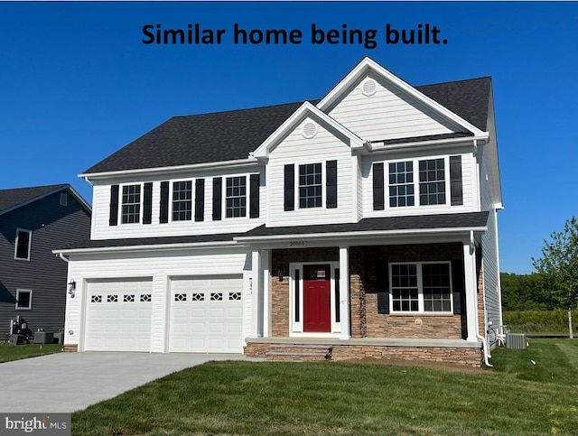 traditional-style home with a porch, a front lawn, cooling unit, driveway, and an attached garage