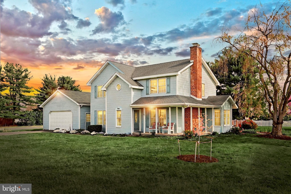 3330 Lewisberry Rd, York, PA 17404 - rear view of house featuring a lawn, a chimney, and a porch