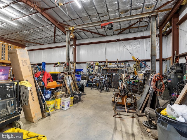 garage featuring a workshop area and a garage door opener