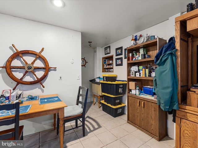 home office with light tile patterned floors