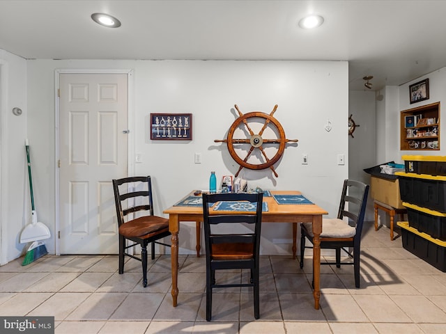dining area featuring recessed lighting and light tile patterned floors