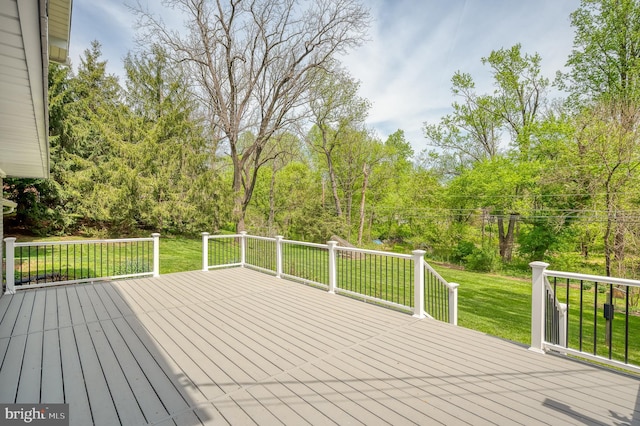 wooden deck with a yard