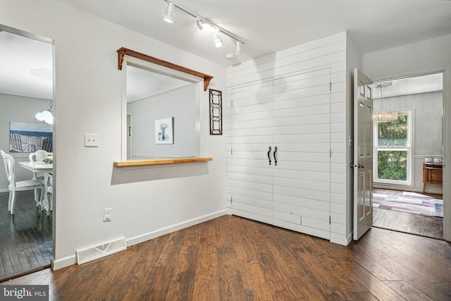 6611 Jupiter Dr, Huntingtown, MD 20639 - interior space featuring visible vents, rail lighting, baseboards, and dark wood-style floors