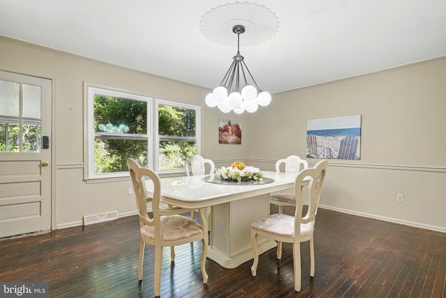6611 Jupiter Dr, Huntingtown, MD 20639 - dining room featuring baseboards, a notable chandelier, dark wood-style floors, and visible vents