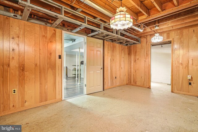 6611 Jupiter Dr, Huntingtown, MD 20639 - below grade area featuring wooden walls and baseboards