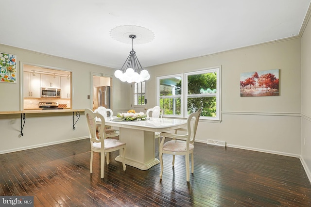 6611 Jupiter Dr, Huntingtown, MD 20639 - dining room with visible vents, baseboards, dark wood-type flooring, and a chandelier