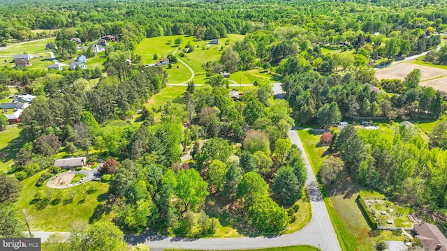 6611 Jupiter Dr, Huntingtown, MD 20639 - birds eye view of property featuring a forest view