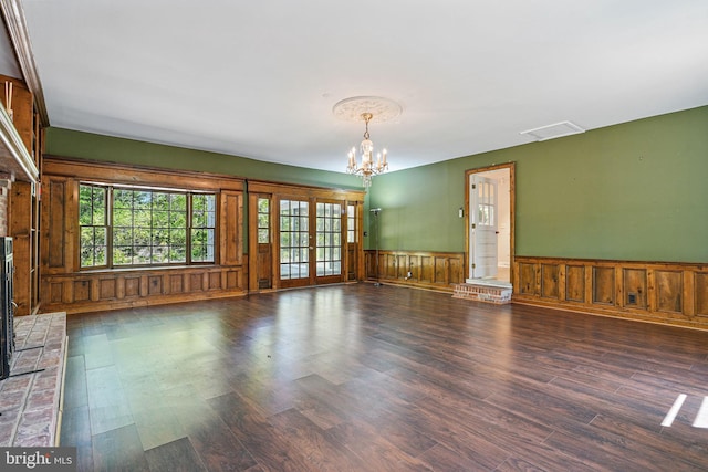 6611 Jupiter Dr, Huntingtown, MD 20639 - spare room featuring visible vents, wainscoting, wood finished floors, and a notable chandelier