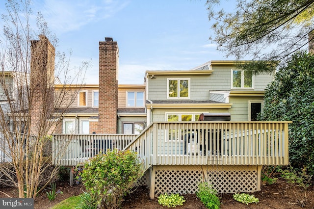55 E Harrison Rd E Unit 55, West Chester, PA 19380 - rear view of house with a deck and a chimney