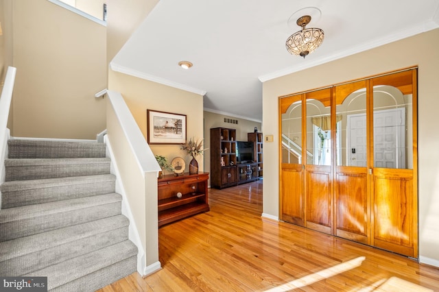 55 E Harrison Rd E Unit 55, West Chester, PA 19380 - entryway featuring ornamental molding, wood finished floors, and stairs