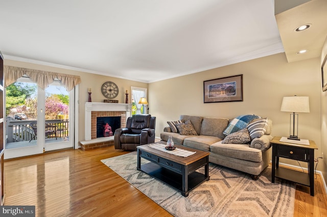 55 E Harrison Rd E Unit 55, West Chester, PA 19380 - living area featuring crown molding, wood finished floors, a brick fireplace, and recessed lighting
