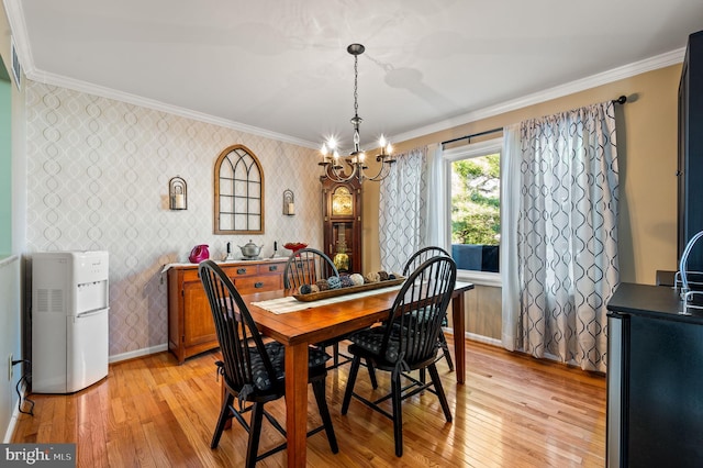 55 E Harrison Rd E Unit 55, West Chester, PA 19380 - dining area with wallpapered walls, a chandelier, ornamental molding, and light wood-type flooring