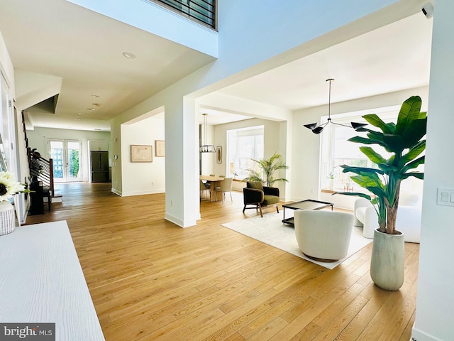 interior space featuring baseboards and light wood-style floors