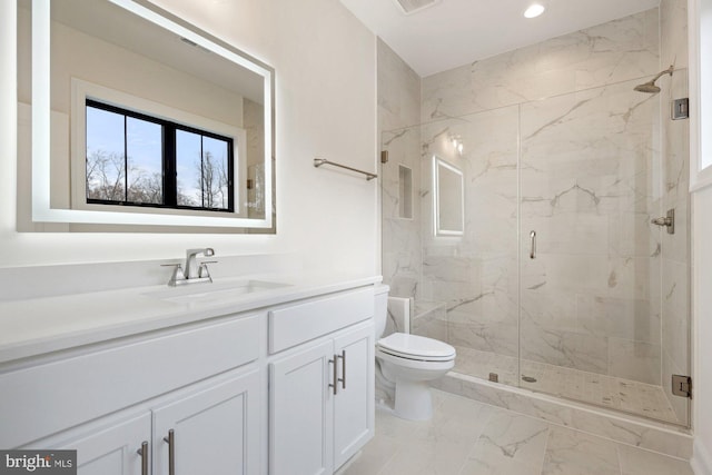 11632 Pine Tree Dr, Fairfax, VA 22033 - full bath with recessed lighting, vanity, toilet, a marble finish shower, and marble finish floor
