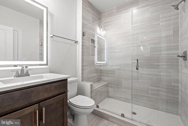 11632 Pine Tree Dr, Fairfax, VA 22033 - bathroom featuring toilet, a stall shower, and vanity