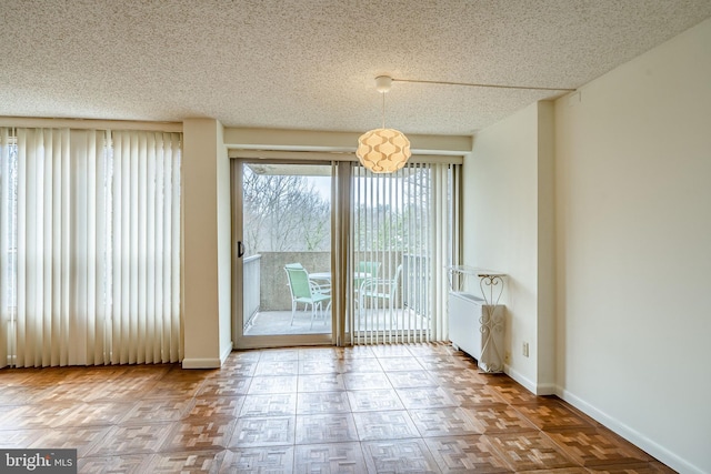 unfurnished dining area with baseboards