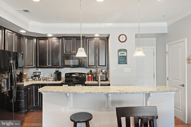 kitchen with crown molding, a breakfast bar, dark wood finished floors, visible vents, and black appliances