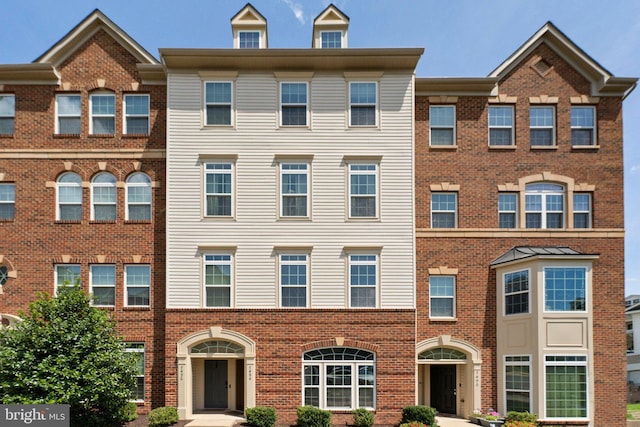 multi unit property featuring brick siding