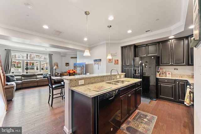 kitchen featuring crown molding, a sink, black appliances, and light wood-style floors