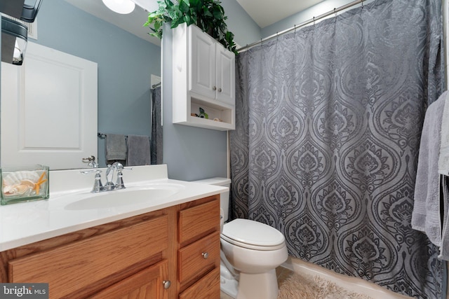 full bathroom featuring vanity and toilet