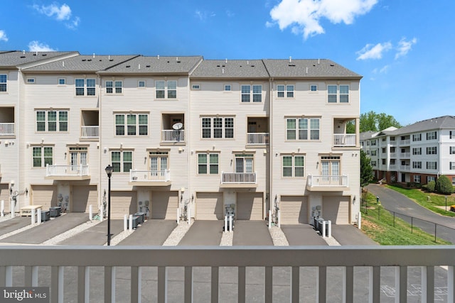 exterior space with a residential view and cooling unit