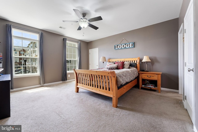 bedroom featuring baseboards, carpet, and ceiling fan