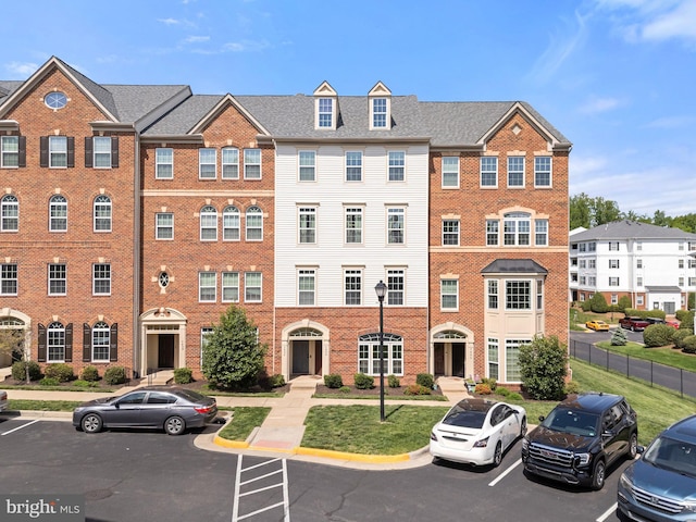 view of property with uncovered parking