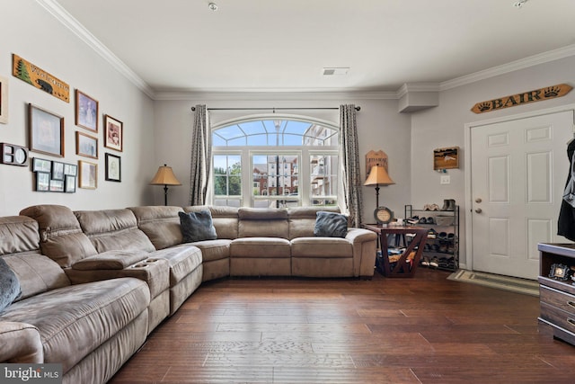 living area featuring crown molding, visible vents, and dark wood-type flooring