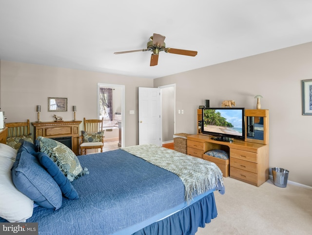 carpeted bedroom with baseboards and a ceiling fan