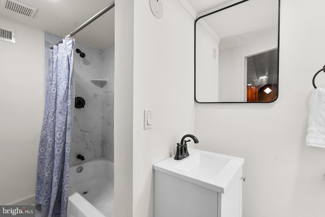bathroom with visible vents, vanity, and shower / bath combination with curtain