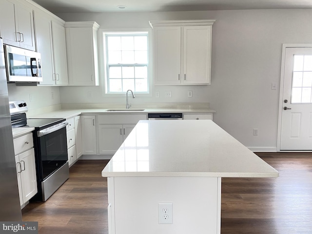 224 Sanibel Way, Martinsburg, WV 25405 - kitchen with a sink, appliances with stainless steel finishes, light countertops, a kitchen island, and dark wood-type flooring