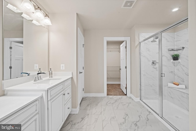 147 Parker Dr, Middletown, DE 19709 - full bathroom featuring vanity, a marble finish shower, marble finish floor, baseboards, and visible vents