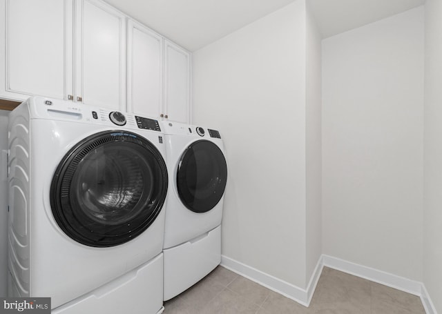 147 Parker Dr, Middletown, DE 19709 - laundry room with cabinet space, light tile patterned floors, baseboards, and washer and clothes dryer