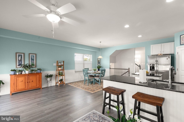 418 N Stokes, Havre De Grace, MD 21078 - kitchen featuring recessed lighting, a sink, stainless steel fridge, wainscoting, and wood finished floors