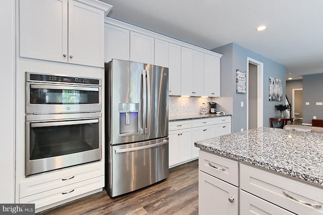 108 Chimney Swift Rd, Fredericksburg, VA 22406 - kitchen with light stone counters, white cabinets, stainless steel appliances, and dark wood-style floors