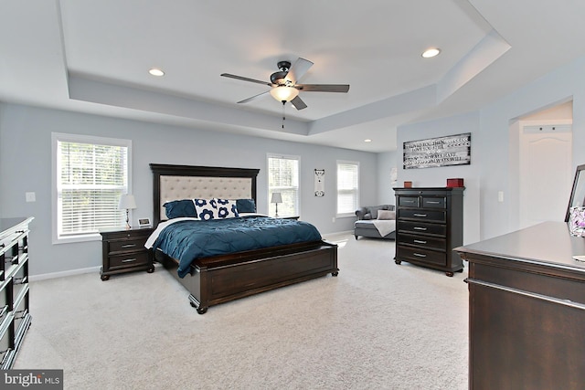 108 Chimney Swift Rd, Fredericksburg, VA 22406 - bedroom with a raised ceiling, baseboards, light carpet, and multiple windows
