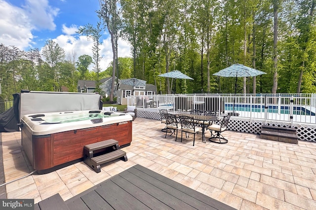108 Chimney Swift Rd, Fredericksburg, VA 22406 - view of patio / terrace featuring a storage unit, a hot tub, a deck, a swimming pool, and an outdoor structure
