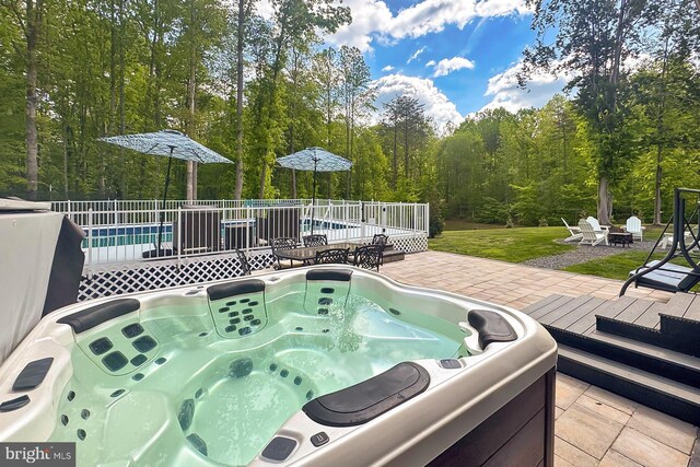 108 Chimney Swift Rd, Fredericksburg, VA 22406 - wooden deck with a swimming pool, a hot tub, a fire pit, and a patio area