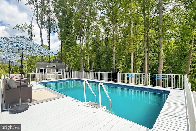 108 Chimney Swift Rd, Fredericksburg, VA 22406 - view of pool featuring a fenced in pool, an outdoor structure, fence, and a deck