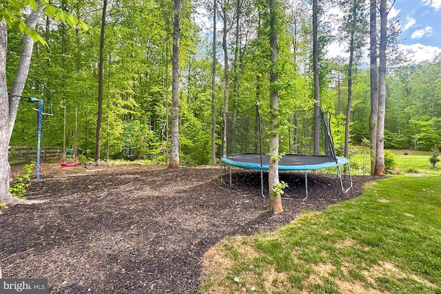 108 Chimney Swift Rd, Fredericksburg, VA 22406 - view of yard with a wooded view and a trampoline