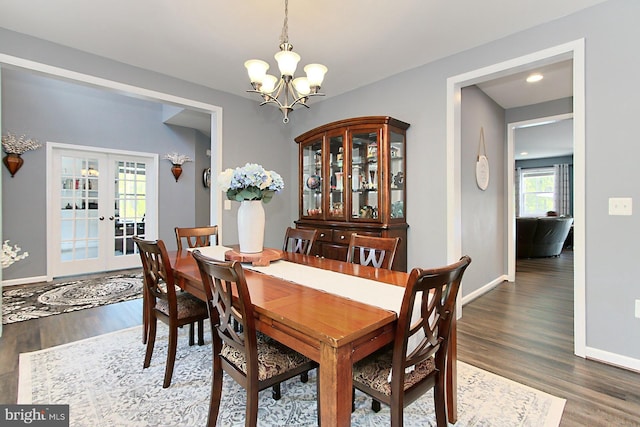 108 Chimney Swift Rd, Fredericksburg, VA 22406 - dining room with an inviting chandelier, baseboards, french doors, and wood finished floors