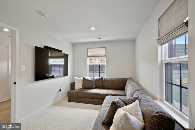 14030 Sunrise Valley Dr, Herndon, VA 20171 - living area with baseboards, visible vents, carpet floors, and plenty of natural light
