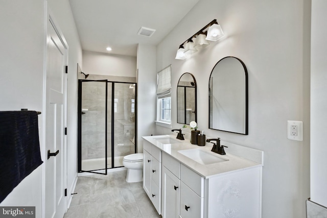 14030 Sunrise Valley Dr, Herndon, VA 20171 - bathroom featuring a shower stall, toilet, double vanity, and a sink