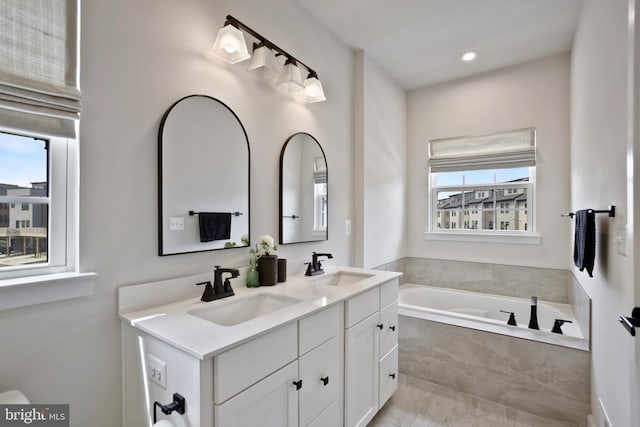 14030 Sunrise Valley Dr, Herndon, VA 20171 - bathroom featuring a bath, double vanity, and a sink